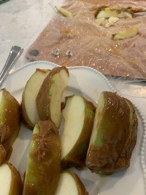 Caramel apple with product sticker still on apple