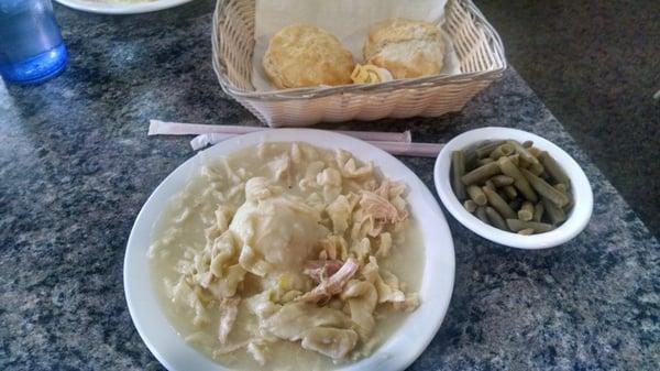 Chicken noodle dinner with green beans and biscuits.