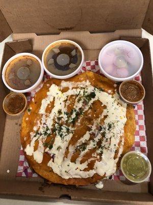 Birria Pizza with consommé, red sauce, green sauce, cucumber slices and radishes. THIS IS THE BOMB it is EXCELLENT!!!