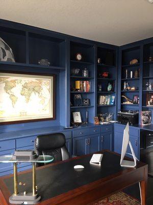 Office with wine fridge, turntable and bookshelves.