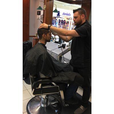 Our barber, Greg Holmes, hard at work!