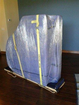 Baby Grand Piano fully protected and ready for transport.