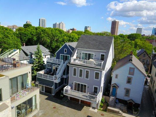 Aerial photo of a couple homes showcasing the city of Milwaukee in the background