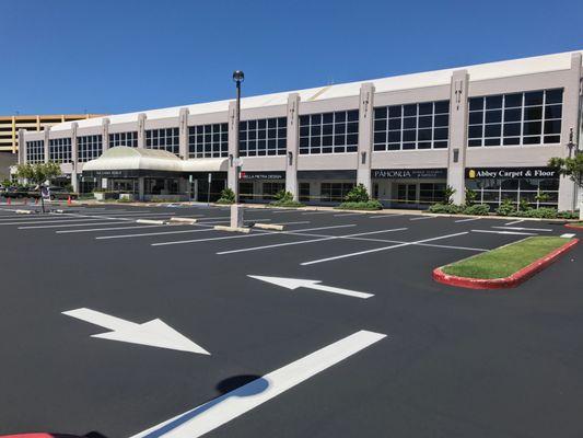 Recent sealcoating asphalt and parking lot striping for the Na Lama Kukui Lifestyle & Design Center at 560 N. Nimitz