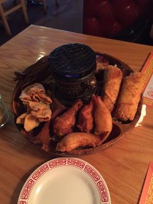 This was out appetizer sampler and it was amazing!! The grill in the center was actually lit on fire.