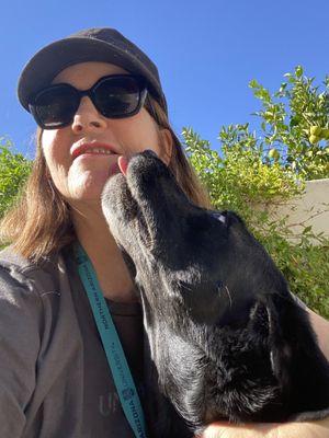 Nicole and sweet Luna, a black lab.