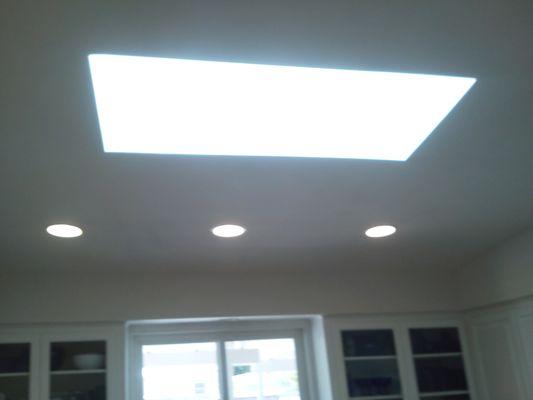 New Velux skylight installation with recessed cans