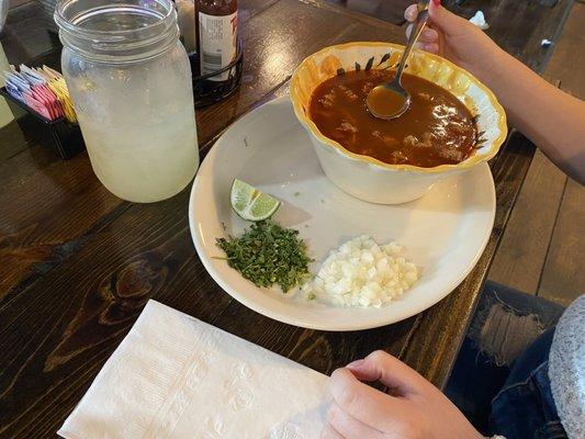 Pozole and condiments.