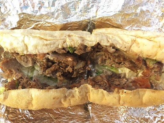 Cheese Steak Supreme sub: Steak and sliced gyro meat, fried onions, tomatoes)