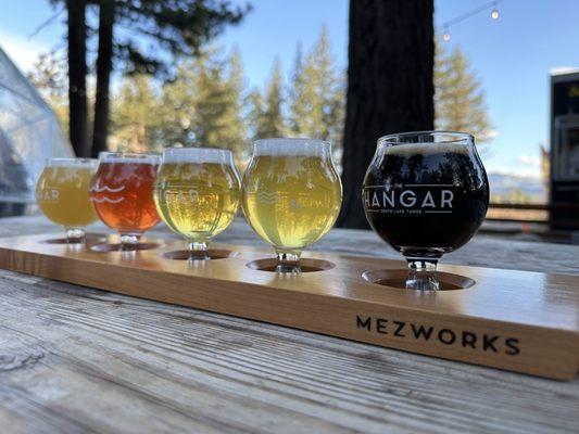 Beer flight with the coziest backdrop