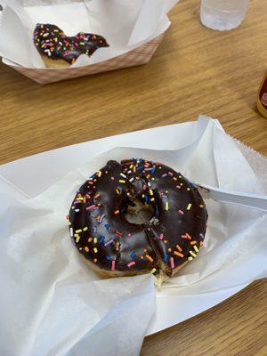 Chocolate frosted donut with sprinkles