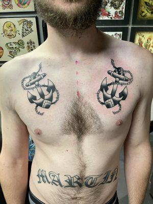 Anchors chest tattoo done by Tyler