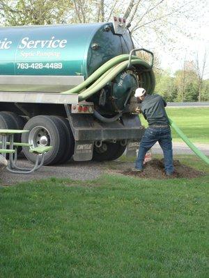 Hooking up the truck to pump a septic tank