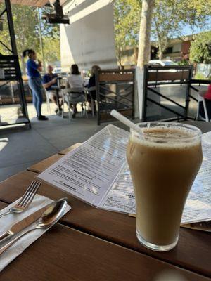 Iced almond milk latte on the outdoor patio - spacious