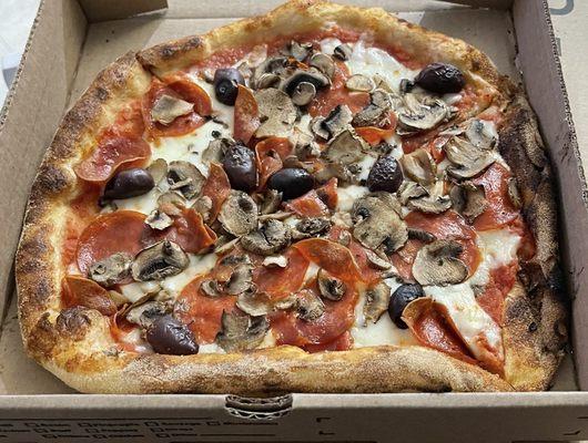 Pepperoni, mushroom and olive pizza