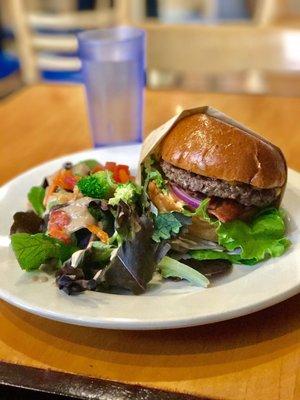 Cali burger with a side salad.