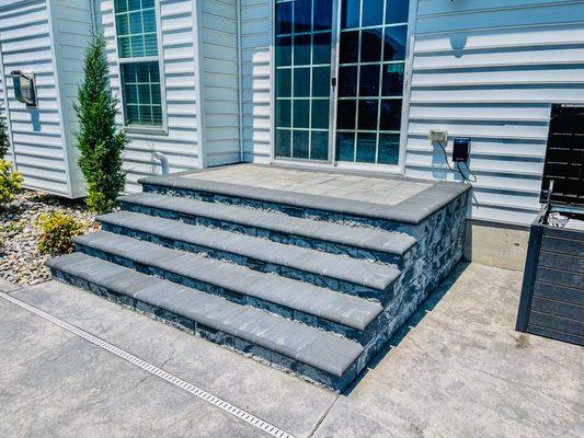 Custom paver steps with lighting installation.