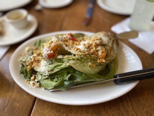 Grilled ice berg lettuce, avocado tomato relish, cotija, corn nuts ($18)