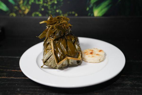 Tamal filled with pork and chicken