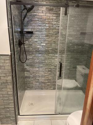 New tub surround and complete with glass shower door