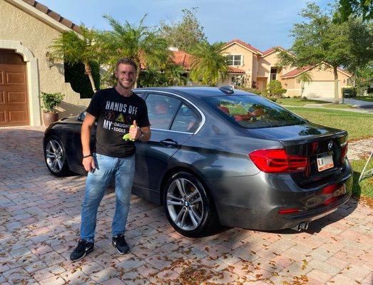 Proud owner and detailer, Eric, after completing a detailing