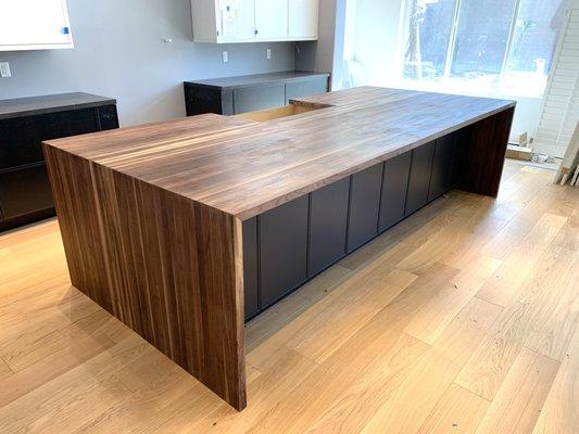 Walnut butcher block island with waterfall sides