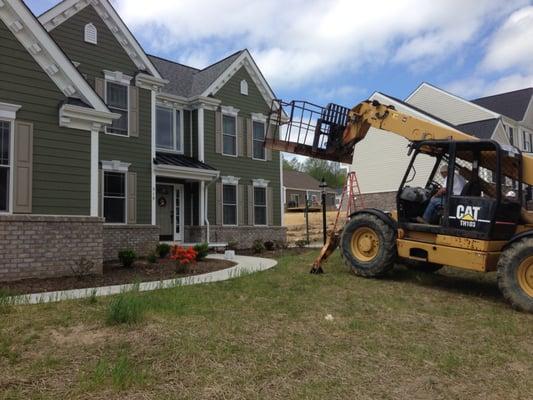 Heartland removing a window on our second floor.  Incorrect window installed.