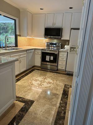 Redone backsplash and granite and cabinets.