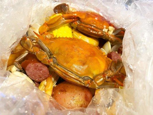 Blue crabs, shrimp Head on Shrimp, and Clams in Garlic butter sauce