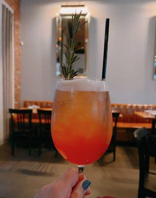 Italian Greyhound: Tito's, grapefruit juice, aperol, prosecco, club soda, rosemary