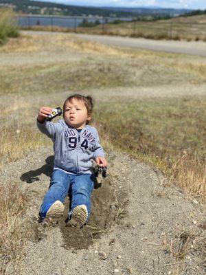 Little Man found the perfect hill for monster truck play. Vroom! Vroom!