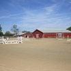 New, 250'x150' sand outdoor arena with show jumps