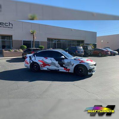 BMW M3 partially 'camo' wrapped with nardo grey, gloss black, and satin red chrome.