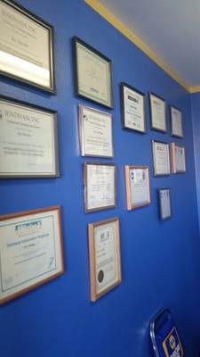 Certificates of training and awards wall.