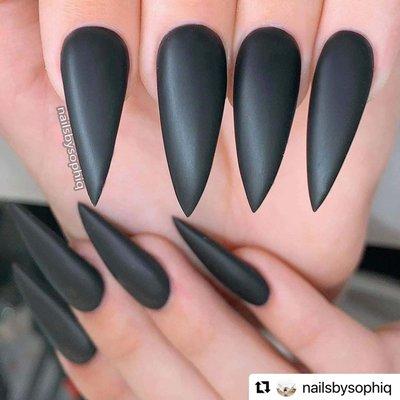 These long black stiletto nails are on point and deserve a standing ovation!