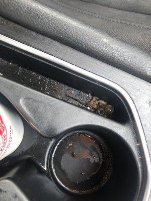 Debris in cup holder, after purchasing in-and-out service.