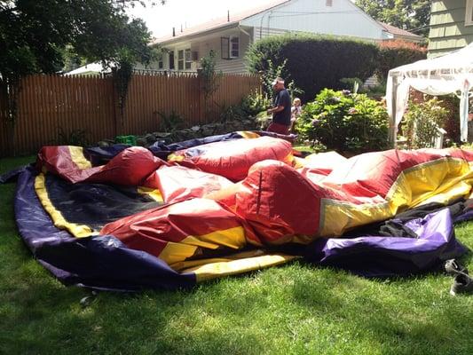 Uninflatable jumpy house covering my lawn as guests are arriving.