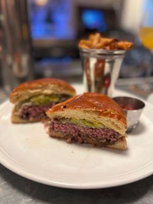 GUILDHALL BURGER: Prime beef, havarti, grilled onion, house pickles, garlic aioli, toasted brioche, fries