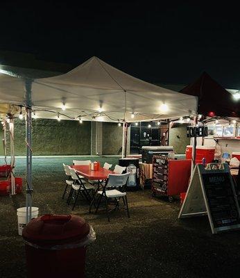 truck and tent at night.