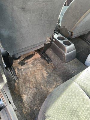 The untouched spot on backseat floor AFTER the car wash was completed