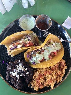 Pulled Pork tacos with Chili Verde, Rice, and Beans.