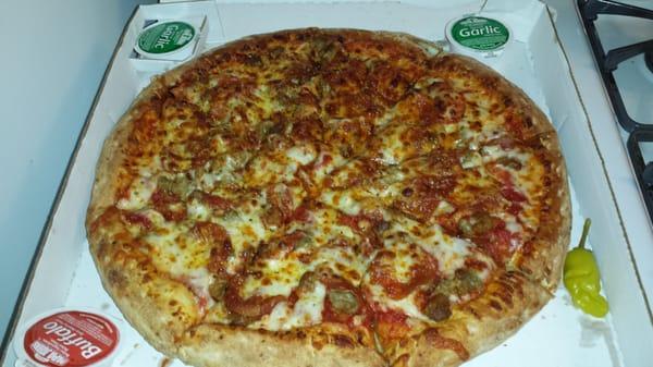 "Papa John's Favorite. " Six cheese, herbs, peperoni, sausage. I added spicy sausage too. Not bad for chain pizza.