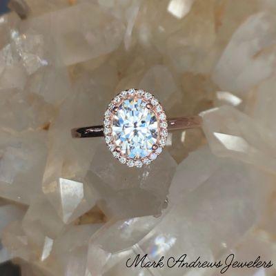 Rose gold, moissanite and diamond engagement ring.