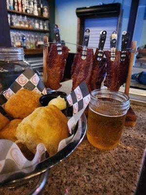 The biscuits with honey butter and cherry jalapeño jelly and the maple bacon with a peach sauce of some sort. Super delicious