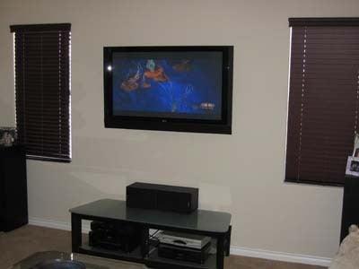 TV Mounted On Wall, With Wires Hidden In Wall.