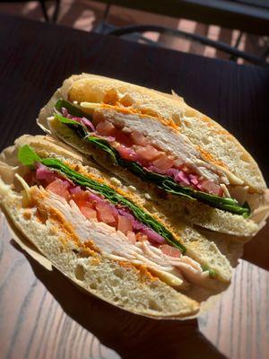 Turkey Sandwich  Toasted Ciabatta Bread with Chipotle, Spinach, Bacon, Red Onion, Fresh Tomato, Turkey, and Swiss Cheese