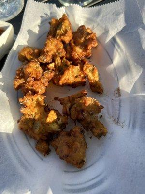 Vegetable pakora.  Order with Kadhi Pakora!