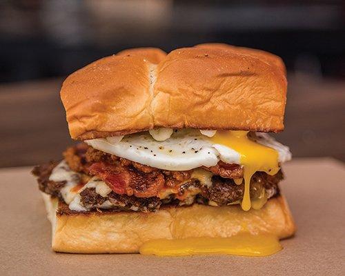 THE HANGOVER- white american cheese, smoked bacon, haus chili, fried egg, mayo