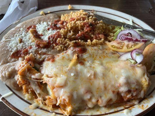 Beef enchiladas & chile relleno combination plate. Sprinkled with the table salsa on top.