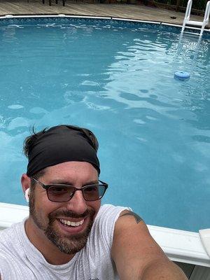 A happy man ready to get into the clear blue water!